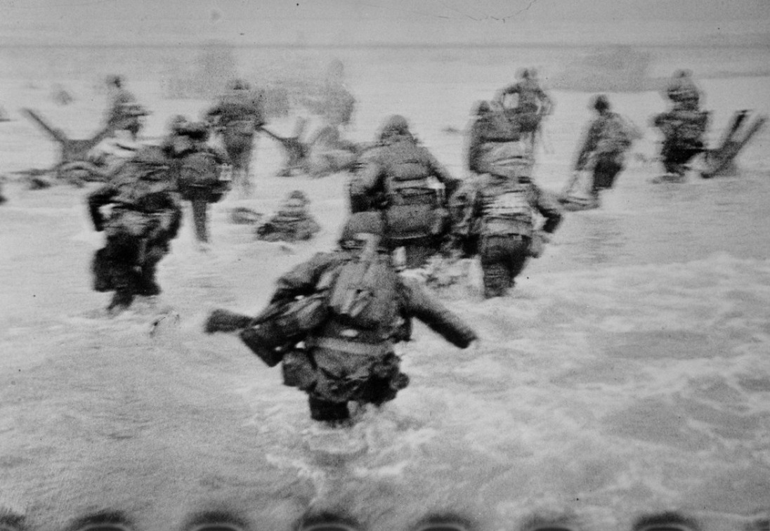 FRANCE. Normandy. June 6th, 1944. US troops assault Omaha Beach during the D-Day landings.